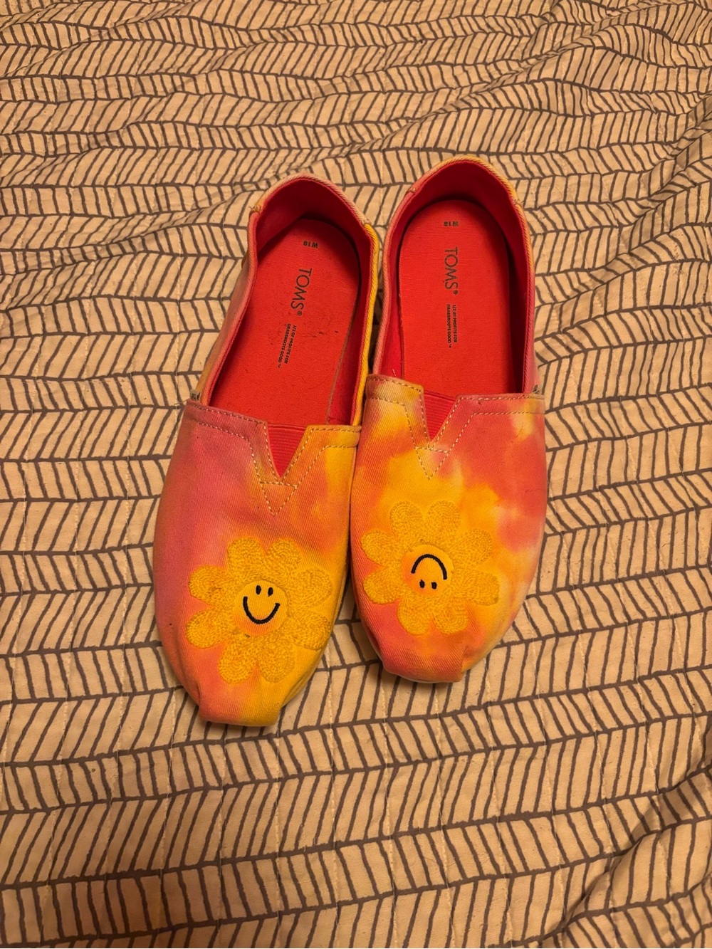 Toms Tie-Dye Slip-Ons in Pink, Orange and Yellow with Smiley Daisy